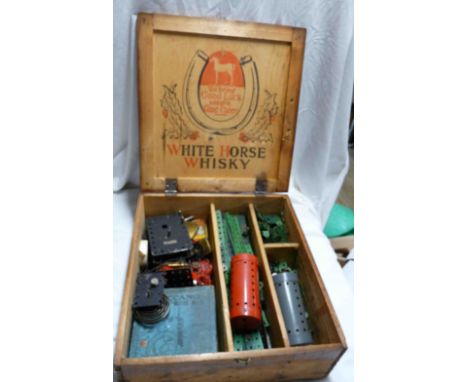 A wooden White Horse Whisky advertising box containing a quantity of vintage Meccano including clockwork motor No 1A