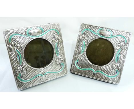 A pair of small marked 'sterling'/GL 915 Art Nouveau design photograph frames with green enamel line detail to the embossed d