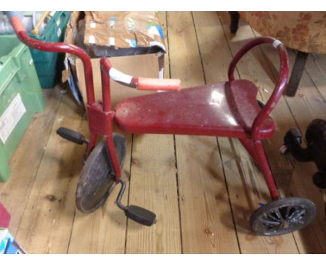 A vintage painted metal child's tricycle
