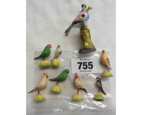 A bag containing a quantity of bird figurines including Chinese enamel and ceramic examples