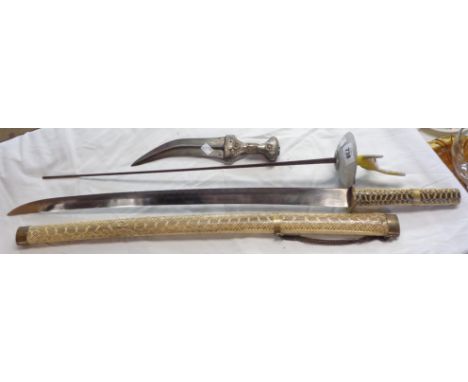 A vintage reproduction Japanese Katana style sword, with faux snakeskin scabbard, a Kris and an old fencing epee