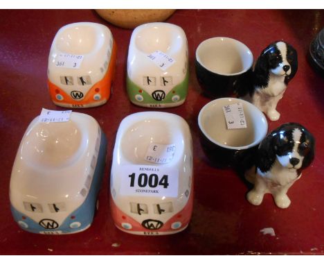 A set of four Volkswagen camper van form egg cups - sold with two Spaniel pattern examples