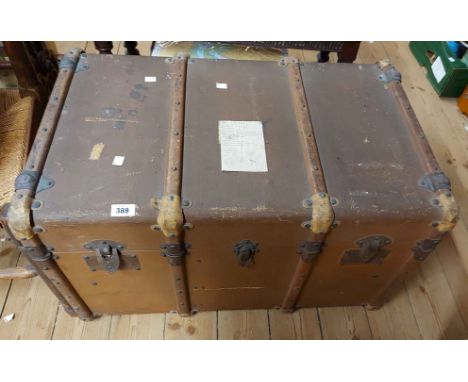 A 79cm French cane bound cabin trunk with canvas weather coating (internal tray missing) - bearing plaque 'Hall Du Voyage'