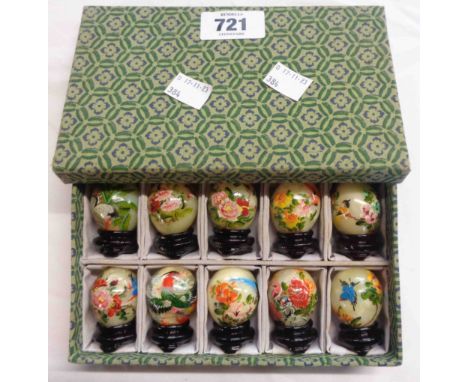 A vintage boxed set of Chinese painted hardstone eggs