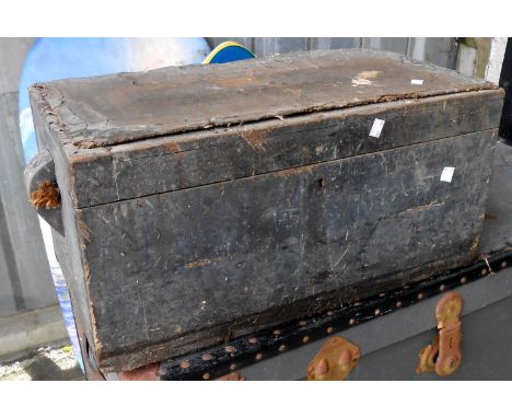An old wooden lift-top toolbox containing a quantity of assorted tools