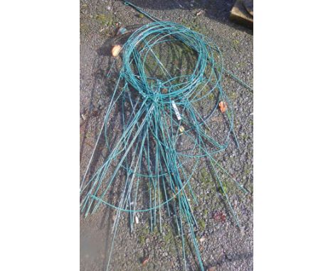 A quantity of green metal hanging plant baskets - sold with a pair of boxed wall hanging tool racks