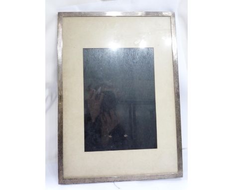A large silver fronted photograph frame with wooden easel back - to take 24cm X 17cm