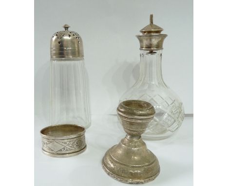 A silver topped cut glass sugar caster and silver topped cut glass oil bottle - sold with silver blank cartouche napkin ring 