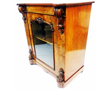 A 78cm Victorian walnut pier cabinet with flanking decorative carved capitals and shelves enclosed by a glazed panel door, se