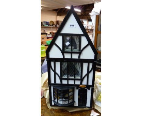 A small doll's house of antique shop form in the mock Tudor style with a large quantity of furniture and accessories, wired f