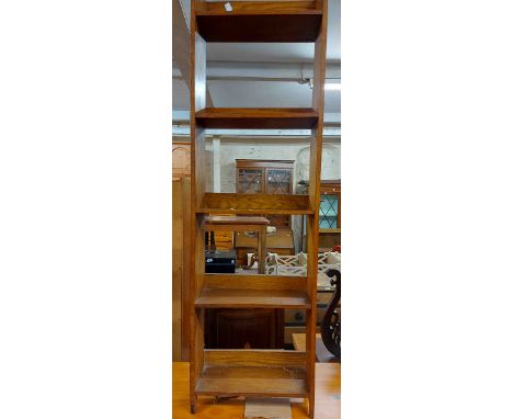 A 36cm vintage stained oak shallow bookcase with five open shelves