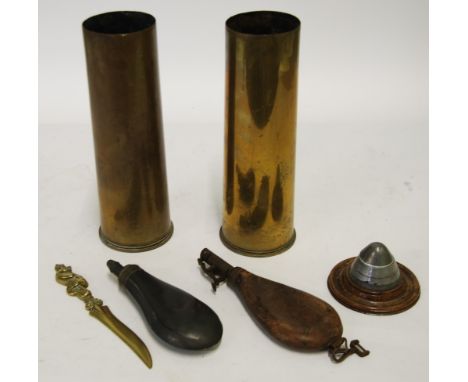 NINETEENTH CENTURY LEATHER SHOT FLASK AND A METAL POWDER FLASK, A MOUNTED SHELL NOSE CONE, ADAPTED INTO AN INKWELL, TWO BRASS