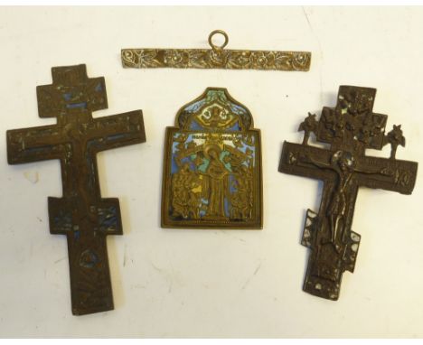 *THREE CAST BRASS 'BRONZED' AND ENAMELLED DEVOTIONAL CRUCIFIXES AND ICON AND ANOTHER ITEM OF CAST BRASS WITH SUSPENSION RING 