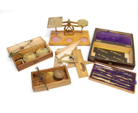 PAIR OF EARLY 20TH CENTURY BRASS POSTAL SCALES on light oak oblong base and a set of four flan shaped weights upto 8ozs two S