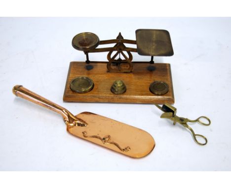 BRASS POSTAL BALANCE SCALES on oak oblong base fitted with a  SET OF 5 BRASS NESTING WEIGHTS,  9" wide,  A PAIR OF BRASS SCIS