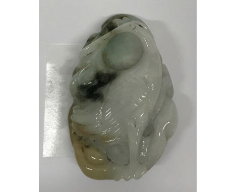 A Chinese carved jadeite jade amulet of a crane with a lotus back, H. 6cm.