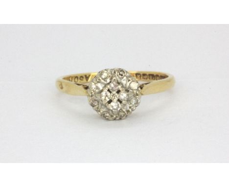 An 18ct yellow gold diamond cluster ring, (O).&nbsp;Weight - 3g.