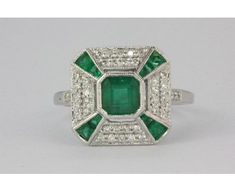 A lovely 18ct (stamped 18k) white gold Art Deco style ring set with emeralds and diamonds (N.5) top size 13mm square