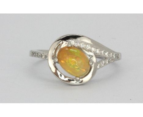 A 925 silver opal and white stone set ring, (O.5).