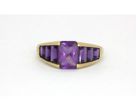 A 9ct yellow gold amethyst set ring, (M.5). Weight - 2.4g.