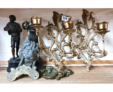 A pair of spelter figurines, four antique brass drawer handles, a brass lions head door knocker and a pair of brass wall scon