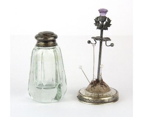 A hallmarked silver hatpin holder set with an amethyst thistle, H. 11cm, together with a hallmarked silver topped dressing ta