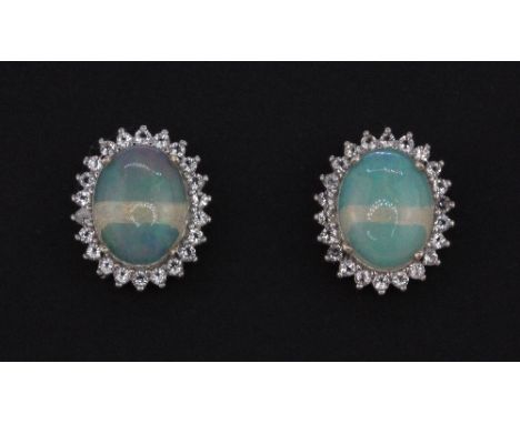 A pair of 925 silver cabochon cut opal and white stone set stud earrings, L. 1.2cm.