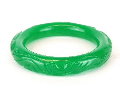 A Chinese carved green jade/ hardstone bangle, internal Dia. 6.2cm.