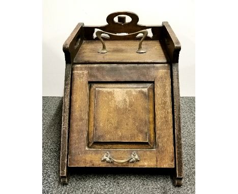 An Art Nouveau mahogany and brass coal box.