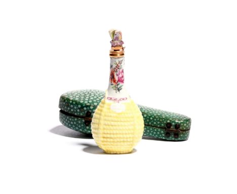 A Chelsea scent bottle  c.1755, modelled as a bottle contained in a yellow wicker basket, the neck painted with sprays of flo