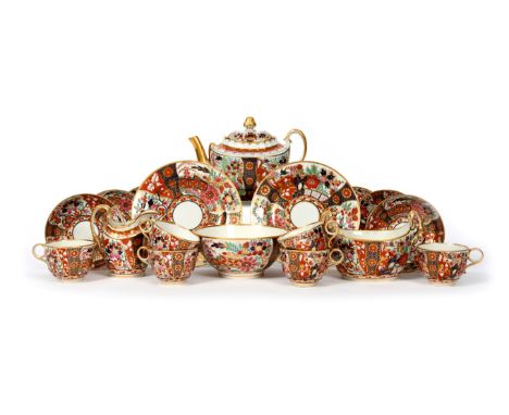 A Barr Worcester tea service  c.1800, richly decorated in an extended Imari palette with panels of stylized flowers, incised 