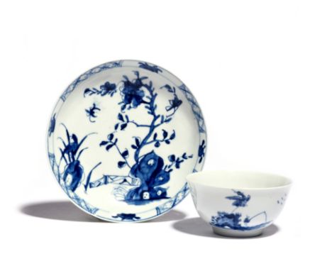 An early Worcester blue and white teabowl c.1754, painted with the Cormorant pattern, a large peony spray to the reverse, and