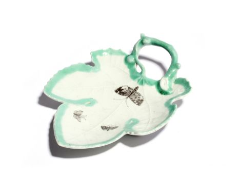 A Worcester leaf dish c.1757, printed in black with three butterflies within a painted pale green border, the handle formed a