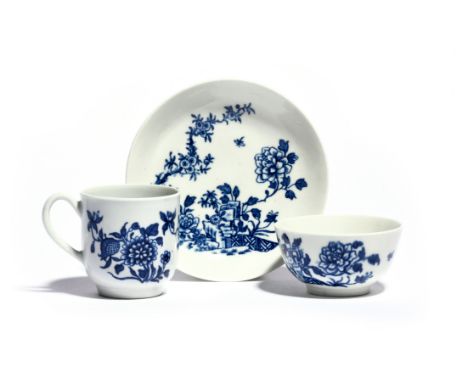 A Worcester blue and white trio  c.1758, comprising a coffee cup, teabowl and saucer, printed with the Creeper pattern, a tal