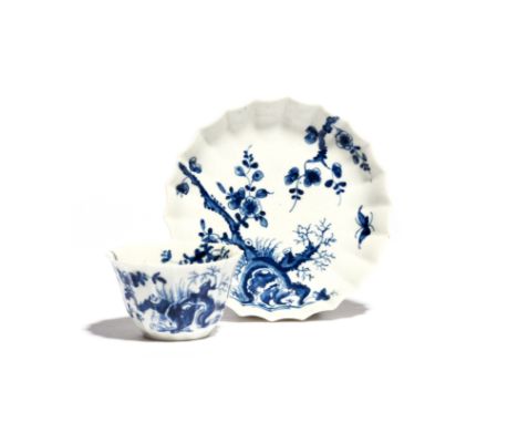 A Worcester blue and white teabowl and saucer  c.1755-58, the Warmstry-fluted forms painted with the Prunus Root pattern, wor