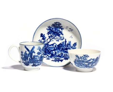 A Worcester blue and white trio  c.1775, comprising a coffee cup, teabowl and saucer, printed with the European Landscape pat