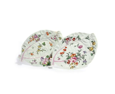 A pair of Worcester double leaf dishes  c.1765, each formed of two crossed long cos leaves, painted with polychrome flower sp