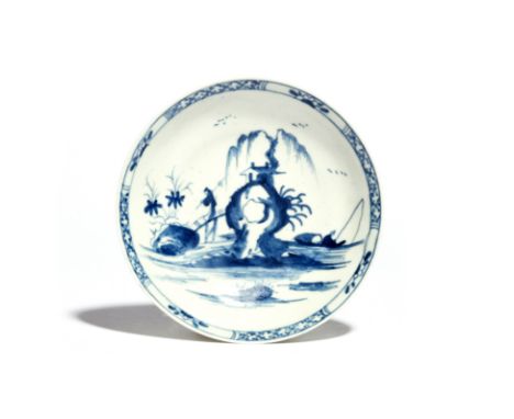 A rare Worcester blue and white saucer c.1754, painted with the High Island pattern, a figure crossing a sloping bridge leadi