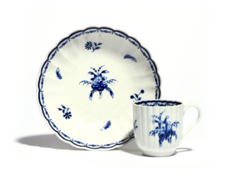 A Worcester blue and white coffee cup and associated saucer  c.1780-90, the fluted forms painted with the Late Floral Bouquet