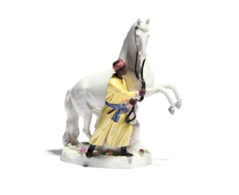 A Meissen figure of an Arab stallion and his groom  19th century, after the model by J J Kändler, modelled with a blackamoor 