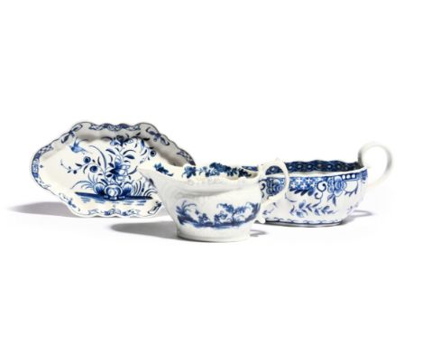Two Worcester blue and white sauceboats  c.1770, one painted with the Two Porter Landscape pattern, the other fluted and pain