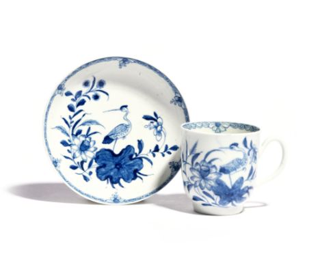 A rare Worcester blue and white coffee cup and saucer   c.1758-60, painted with the Heron on a Floral Spray pattern, each pie