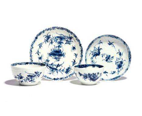 Two Worcester blue and white teabowls and saucers  c.1765, one painted with the Feather Mould Birds pattern, the other with t