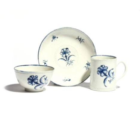 A rare Worcester blue and white trio  c.1770, comprising a straight-sided can or small mug, a teabowl and saucer, all painted