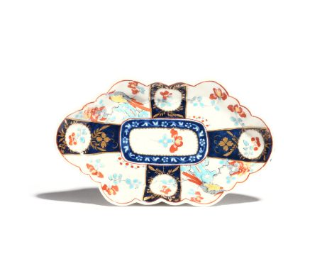 A Worcester spoon tray c.1760, painted with a variation of the Joshua Reynolds pattern with panels of long-tailed birds and f