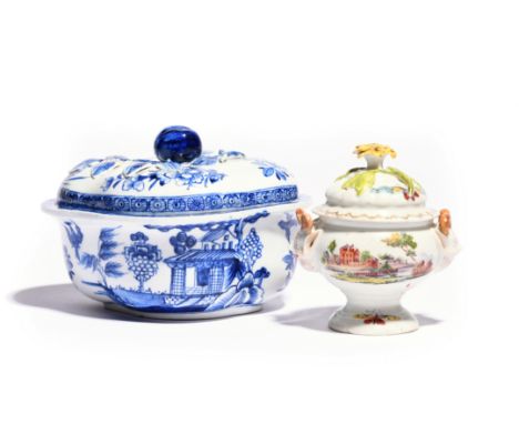 A Derby blue and white sauce tureen and cover  c.1765, the quatrefoil form painted with birds in flight around Chinese buildi