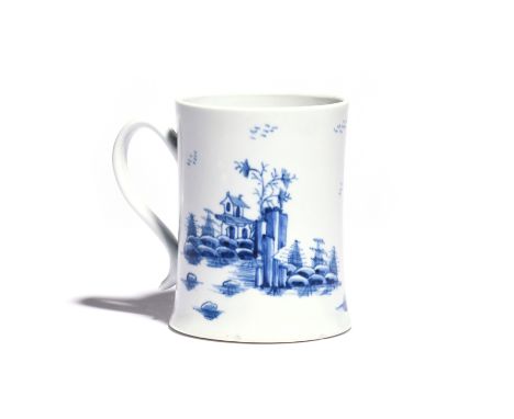 A large Worcester blue and white mug of Scratch Cross type  c.1754, of cylindrical form with a spreading foot, painted with t