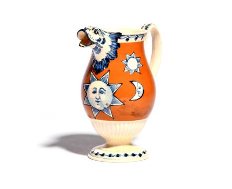 An unusual creamware jug  c.1800, the baluster body painted with Masonic sun and moon symbols in blue against a russet brown 