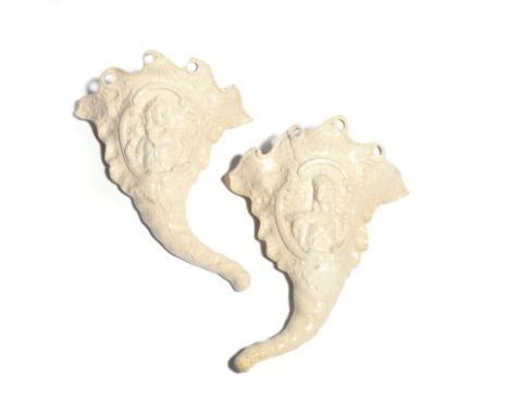 A pair of salt-glazed stoneware cornucopia wall pockets c.1760-70, each elaborately moulded with a head and shoulders portrai