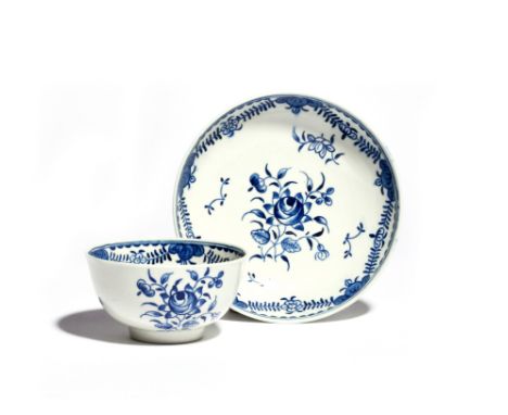 A rare Worcester blue and white teabowl and saucer  c.1785, the generous forms painted with the Formal Rose Spray within a st